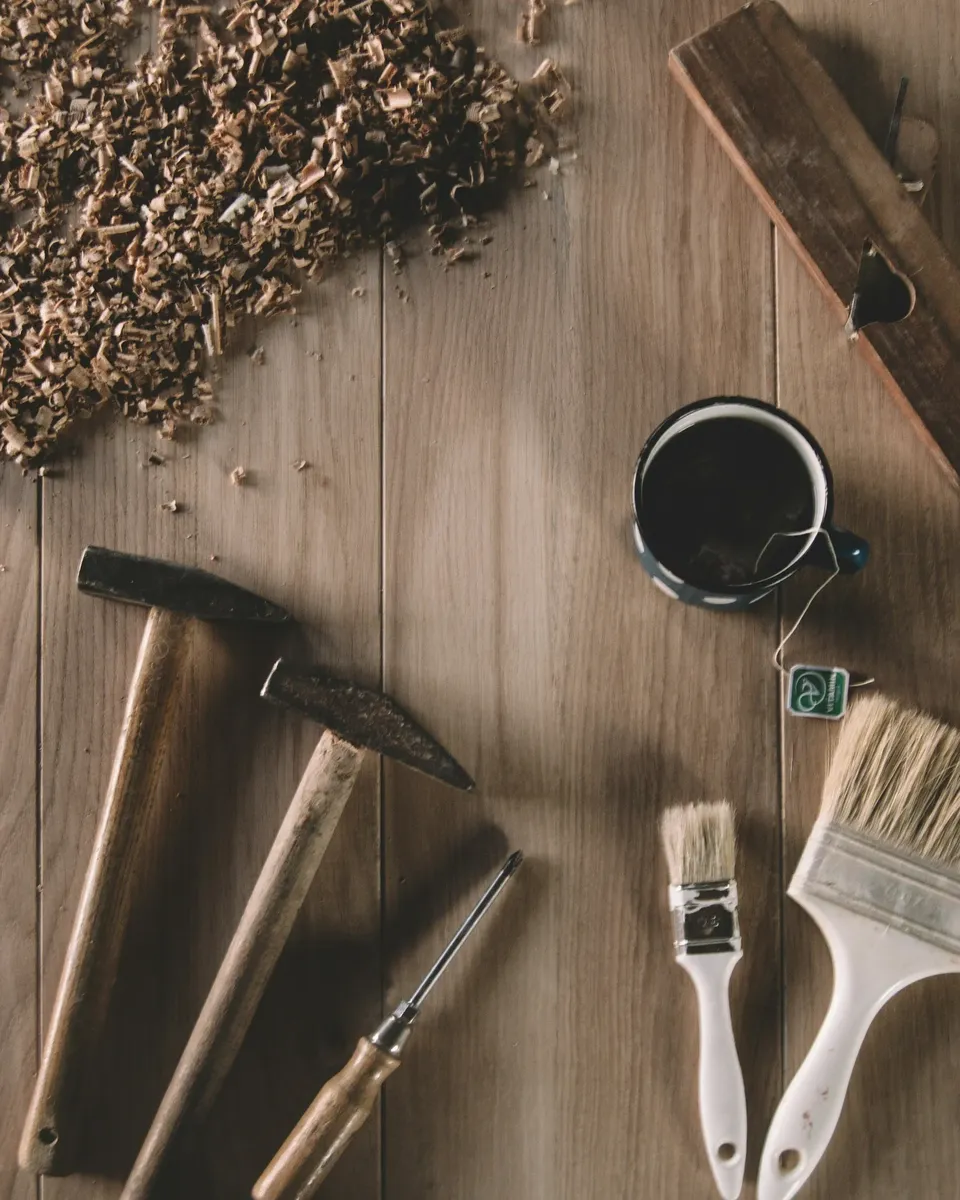 Carpentry hammers, chisels and brushes on an oak workbench – Good Oak Custom Carpentry
